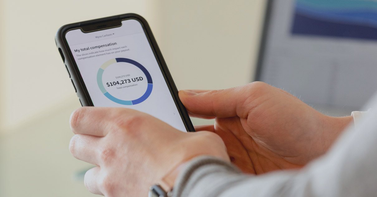 Employee viewing compensation information on mobile device